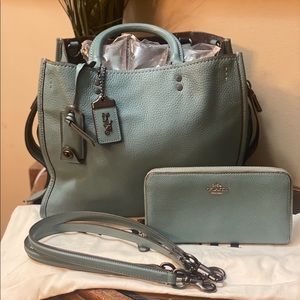 EUC Coach Rogue 30, Marine in color with matching wallet.